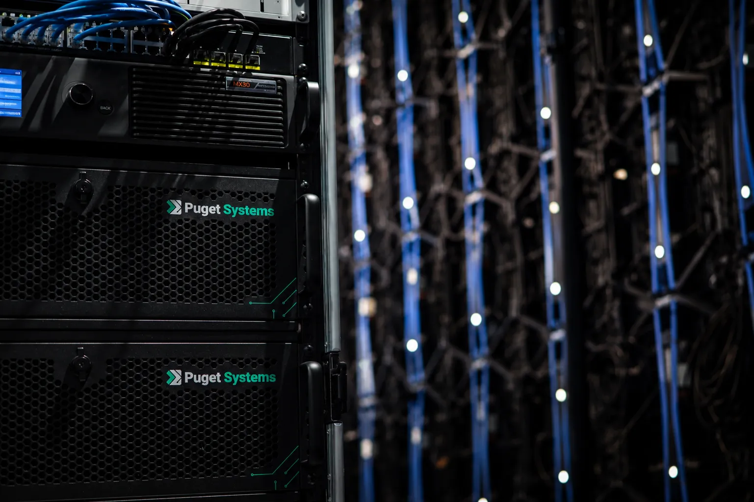 Puget Systems workstations and media servers racked beside the LED volume at the Cinedept partner studio