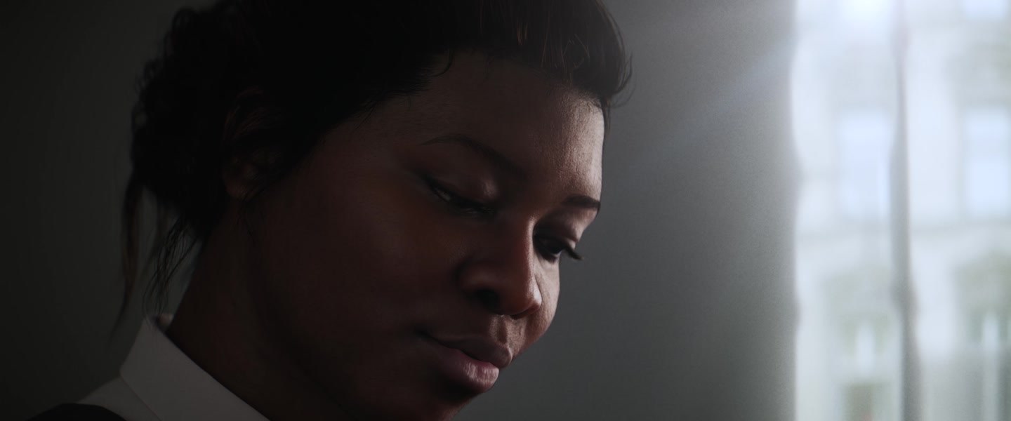 Close-up of a Recall character in soft window light, finished in Nuke with shallow depth of field and lens effects
