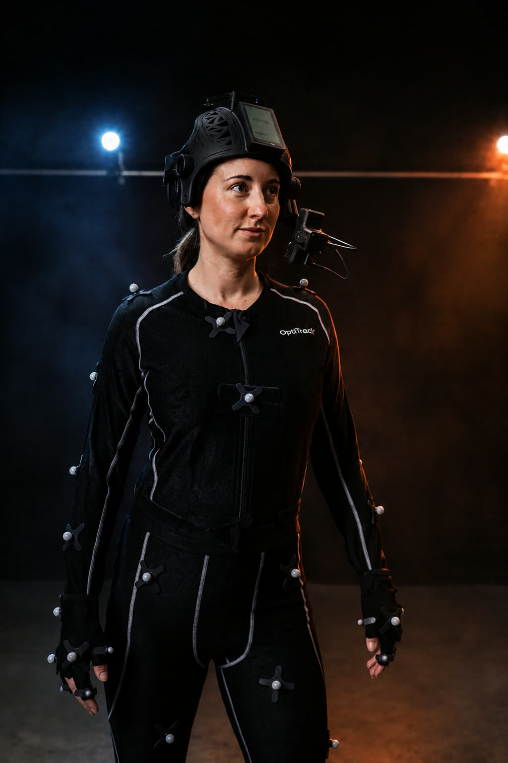 Performer in full OptiTrack motion capture suit with stereoscopic head-mounted camera unit