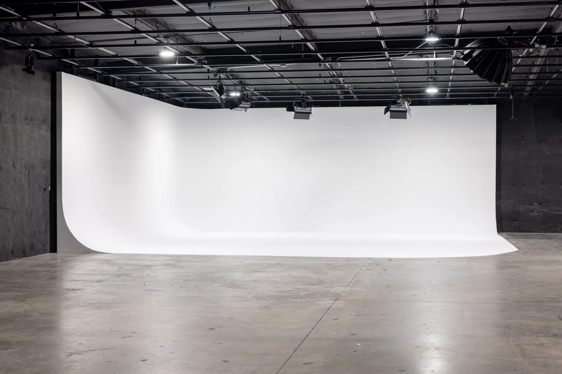 White cyclorama with overhead lighting grid
